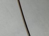 a close up of a piece of metal on a white surface