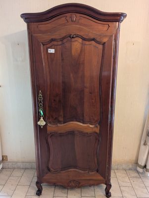 a wooden cabinet with a door in the middle of it