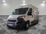 a white van that is parked on a checkered floor
