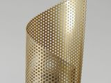a close up of a lamp on a table with a cord