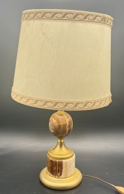 a lamp that is sitting on top of a table next to a lamp