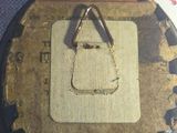 a button with a triangle on it on a white surface