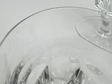 a glass bowl with ice cubes in it on a table