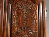 a close up of a wooden door with carvings on it