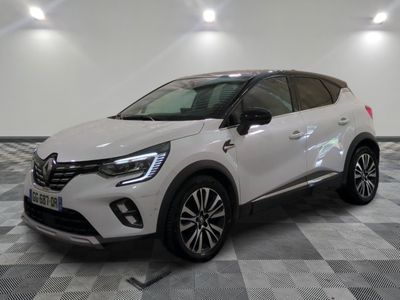 a white car is parked in a room with a checkered floor