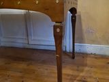 a wooden table with a drawer on top of it