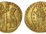 une pièce d'or portant l'image d'une femme et d'un homme