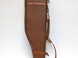an image of a brown leather case with a strap on it