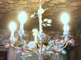 a chandelier that is hanging from the ceiling in the room