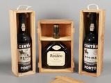 two bottles of wine in a wooden box with a corket