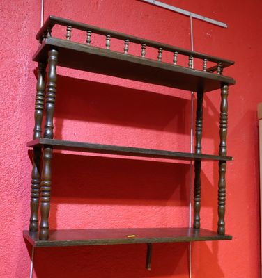 a shelf that has a wooden shelf on top of it
