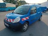 a blue van that is parked in a parking lot