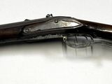 an image of a pair of guns on a white surface