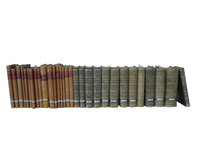 a lot of books that are stacked on top of each other