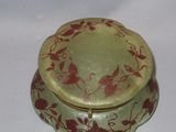 a green and red box with a bird design on it