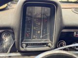 a dashboard of a car with a speedometer in it