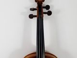 a close up of a violin with a bow on a white background