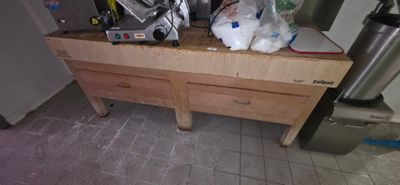 a kitchen counter with a bunch of items on top of it