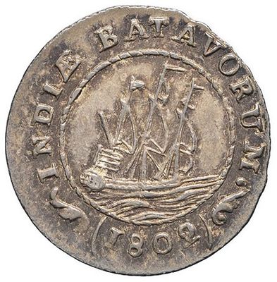 a silver coin with a ship on it on a white background