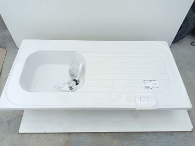 a white sink sitting on top of a white box