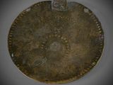 a close up of a metal object with holes on it
