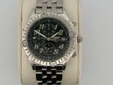 an image of a wrist watch with a black face and a silver bracelet