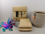 a box, a vase, and a pair of scissors on a table