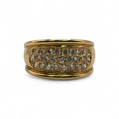 a close up of a gold ring with diamonds on a white background