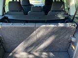 a trunk of a car with the back seats folded down