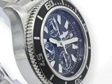 rolex watch with a blue dial and black bezel