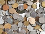 a lot of coins that are on the table