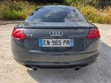 a black audi car parked in a parking lot