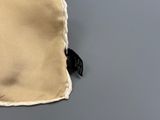 an image of a close up of a bag with a tag on it