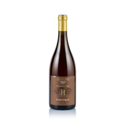 a bottle of wine sitting on top of a white surface
