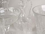 a lot of glassware on a table with a white background