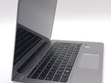 a close up of a laptop computer on a white surface
