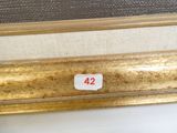 an image of a close up of a gold frame with a number 42 on it