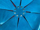 a blue flower shaped object on a red surface