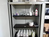 a cabinet with many items on it in a room