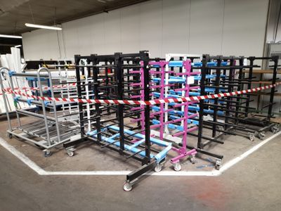 many carts that are lined up in a warehouse