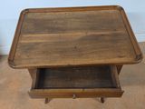 a small wooden table with a drawer underneath it