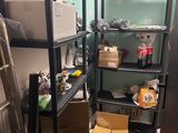 a room with a ladder, shelves, and boxes in it