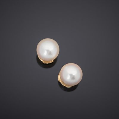 a pair of cultured pearl and diamond earrings