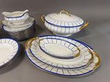 a lot of plates and bowls that are on the table