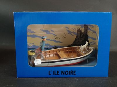 une boîte bleue contenant une maquette de bateau