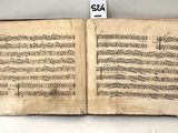 an old book with music written on it