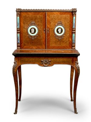 an old wooden cabinet with two doors and a drawer on top of it