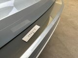 a picture of a car with a sticker on it ' s bumper