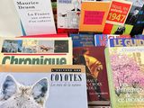 a lot of books that are sitting on a table