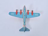a toy airplane that is sitting on a white surface